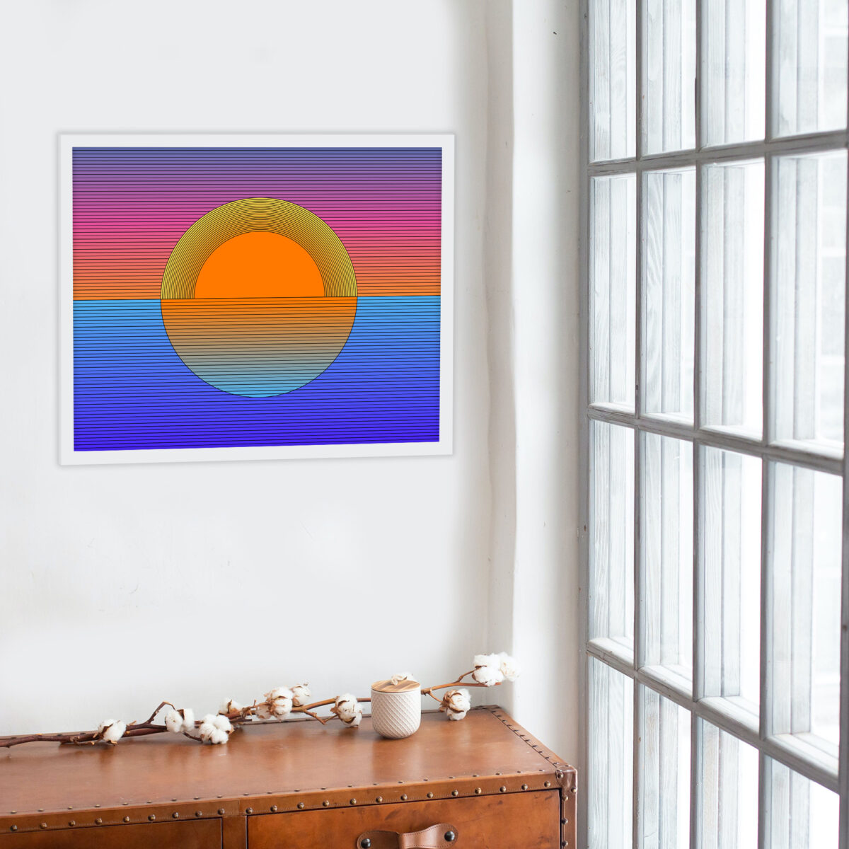 White framed Sunset art print hanging on a wall