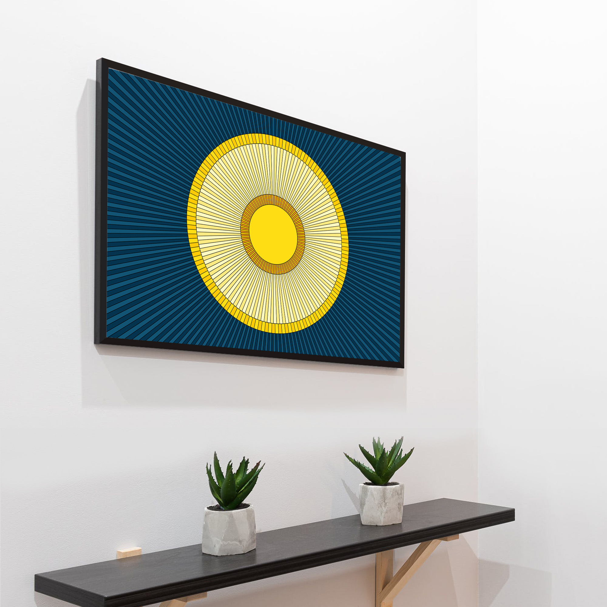 Photo of a Solstice framed art print hanging on a wall above a table.