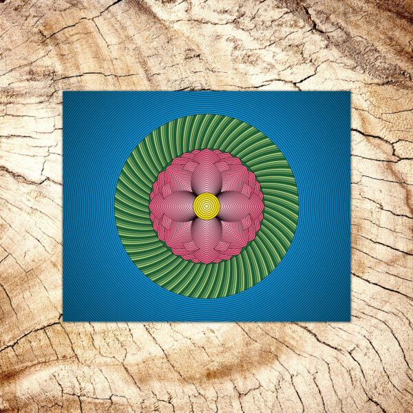 Photo of a Lotus Flower art print laying on a wood table.