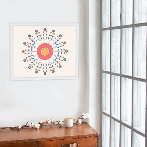 Photo of a Tribes framed art print hanging on a wall over a side table.