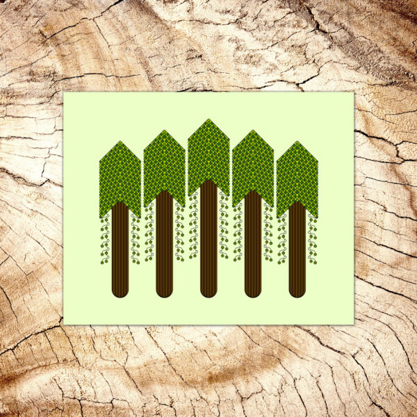 Photo of a Forest art print laying on a wood table.